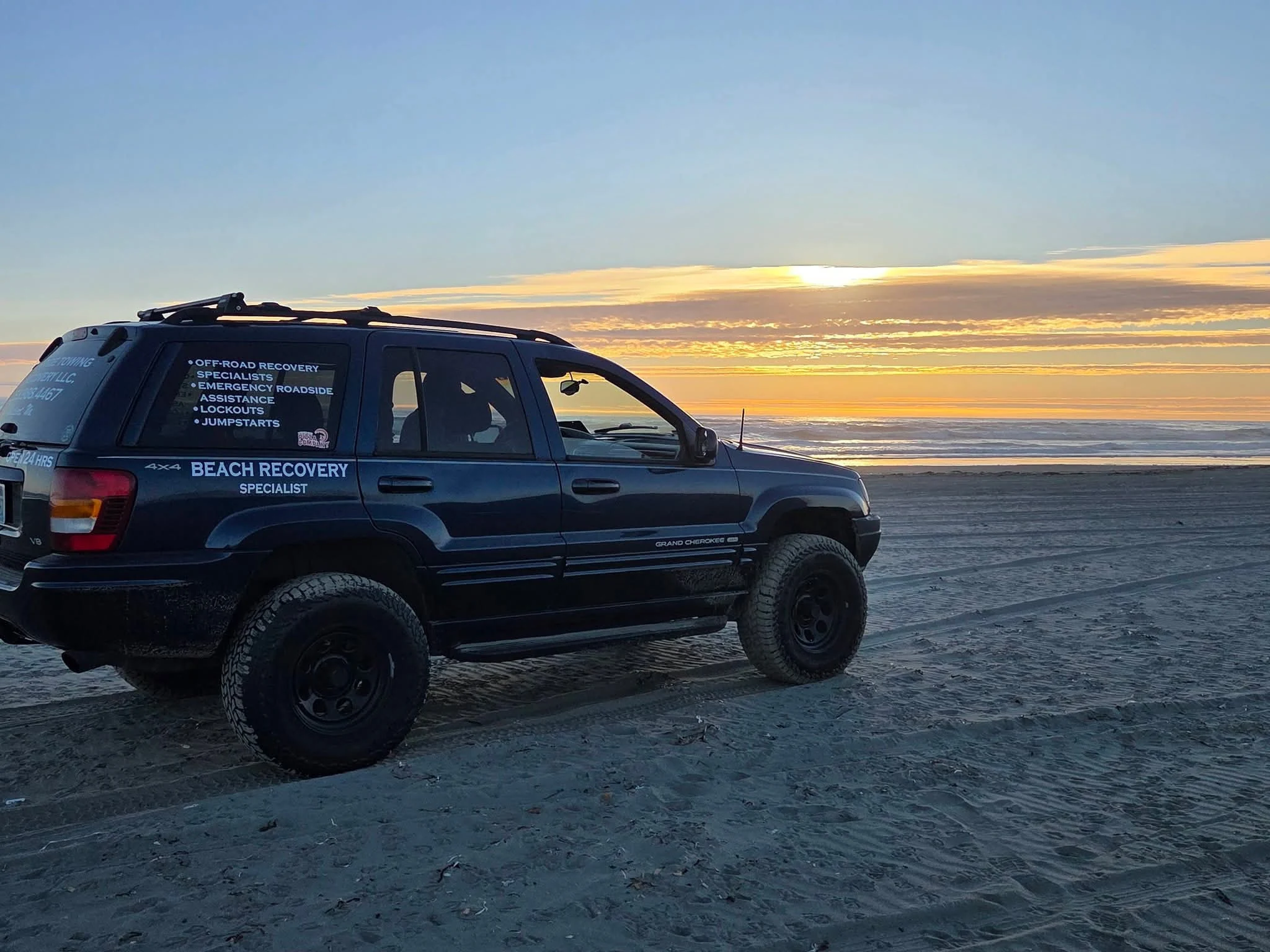 High Tide beach recovery vehicle on the Washington coast at sunset