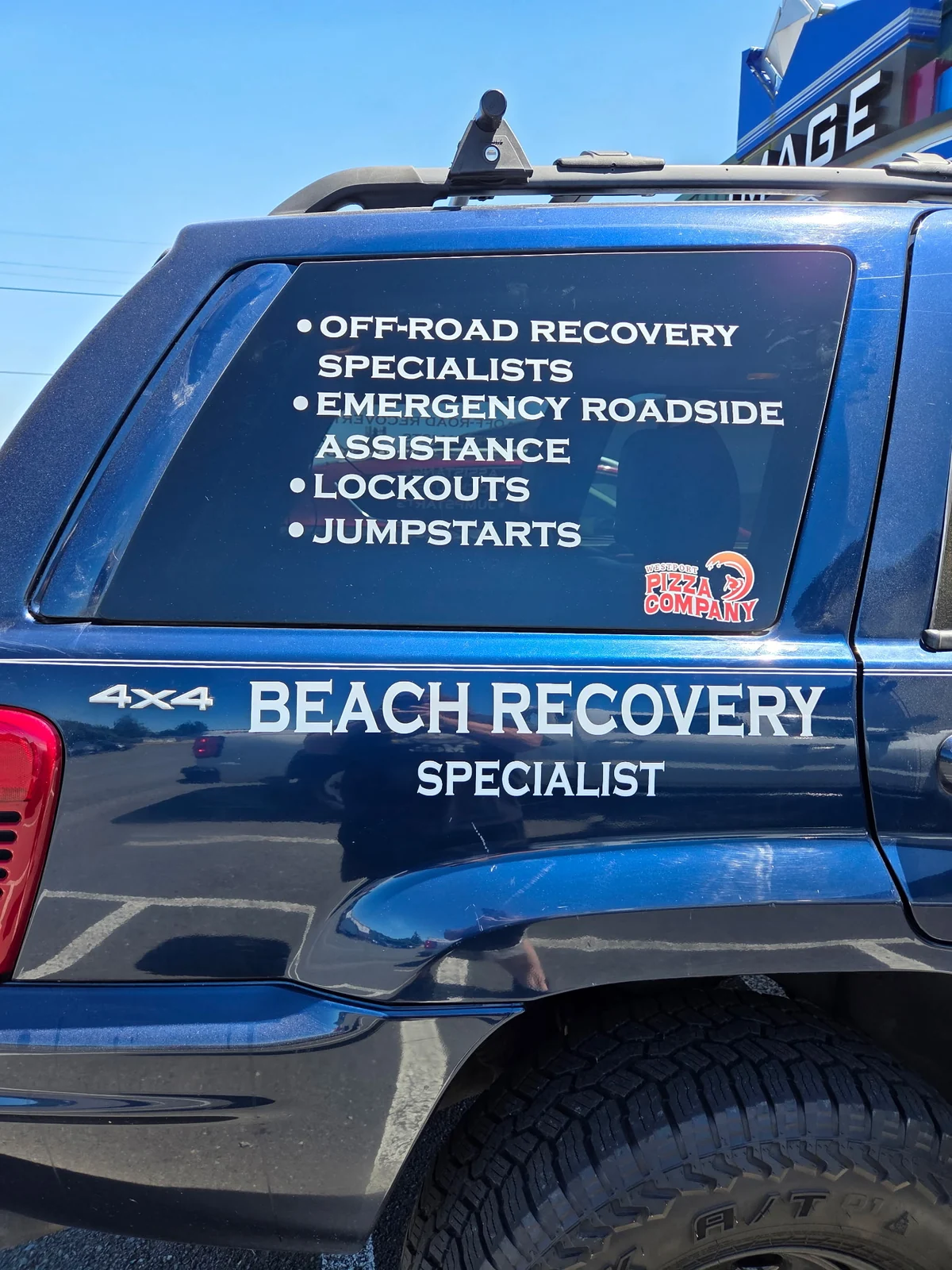 High Tide blue four-wheel-drive beach recovery vehicle